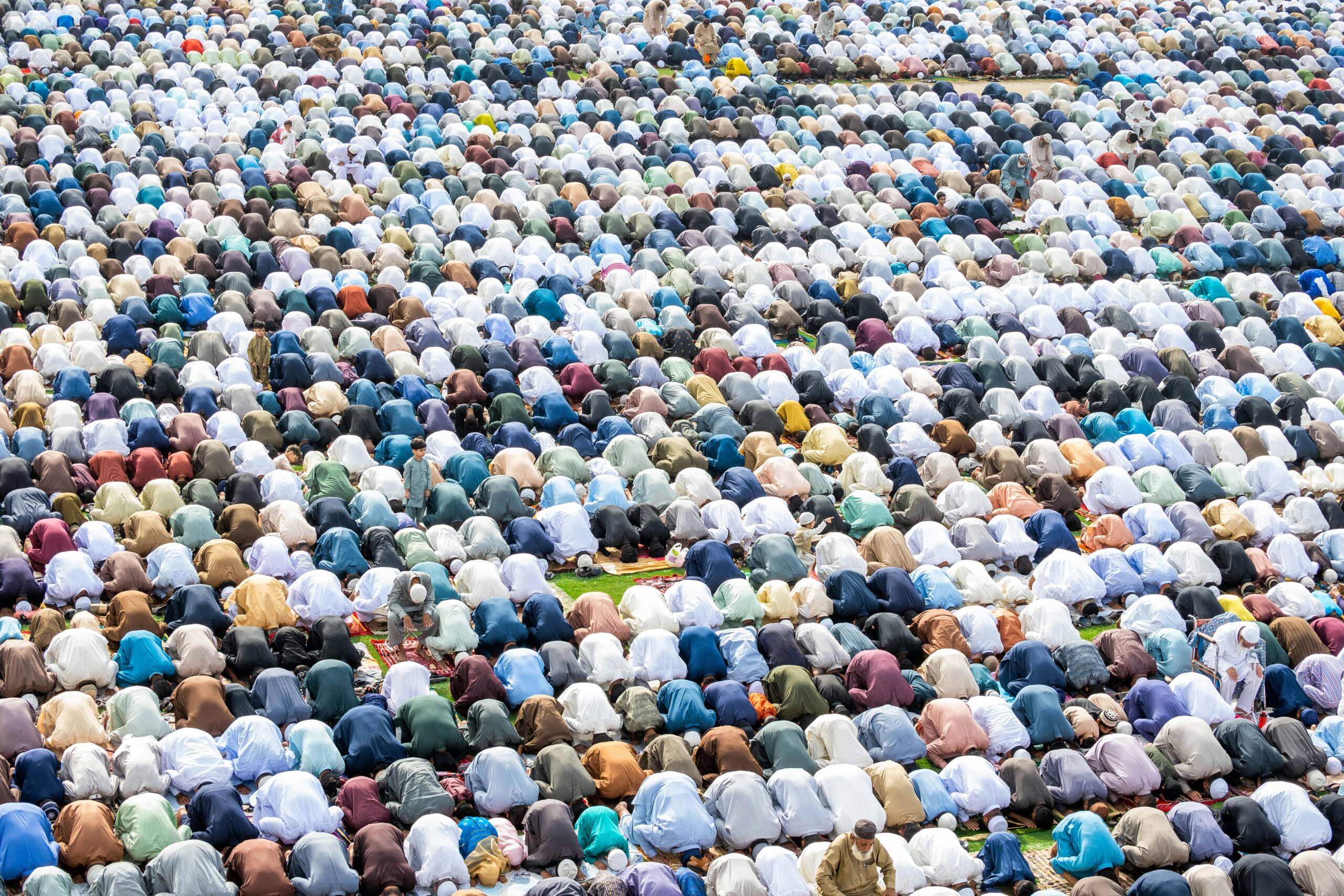 A group of people pray as part of the celebrations of Ramadan.